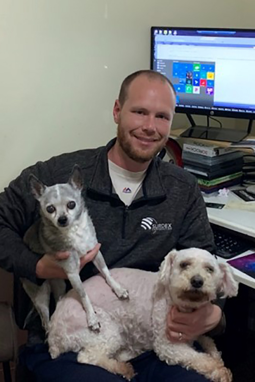 Dan with his dogs Little Man (left) and Petey (right)